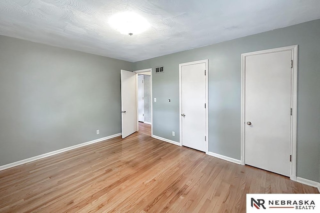 437 S 90th St, Omaha, NE 68114 - unfurnished bedroom with baseboards and light wood-style floors