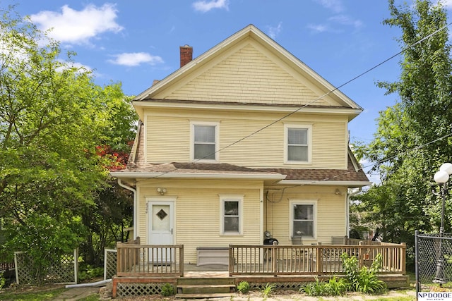 4340 Miami St, Omaha, NE 68104 - rear view of house with a chimney, a deck, and roof with shingles