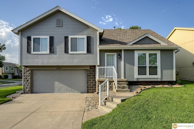 18653 Borman St, Omaha, NE 68135 - tri-level home featuring a garage, a front lawn, driveway, and a shingled roof