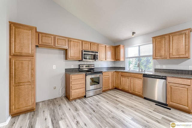 18653 Borman St, Omaha, NE 68135 - kitchen with appliances with stainless steel finishes, light wood-style flooring, high vaulted ceiling, and dark stone countertops