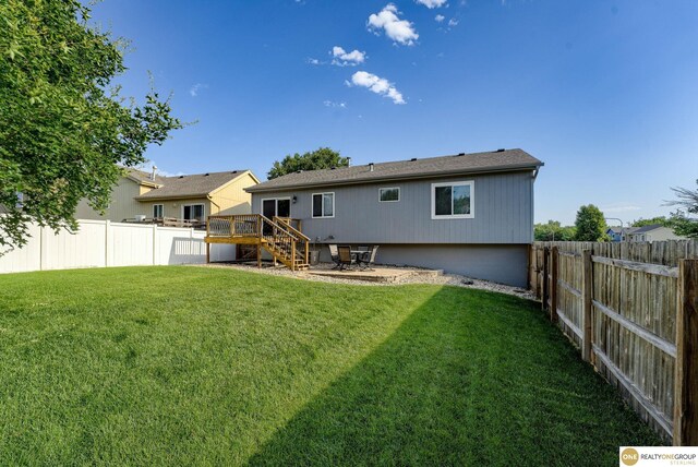 18653 Borman St, Omaha, NE 68135 - rear view of property featuring a fenced backyard, a deck, and stairway