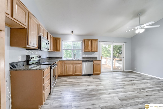 18653 Borman St, Omaha, NE 68135 - kitchen with stainless steel appliances, light wood finished floors, a ceiling fan, and vaulted ceiling