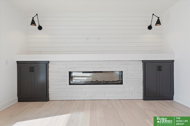 5721 N 197th Ave, Omaha, NE 68022 - detailed view of wood finished floors and a glass covered fireplace