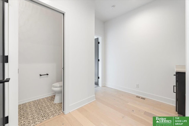 5721 N 197th Ave, Omaha, NE 68022 - bathroom featuring wood finished floors and vanity