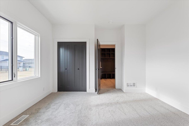 5721 N 197th Ave, Omaha, NE 68022 - unfurnished bedroom featuring carpet flooring and a closet