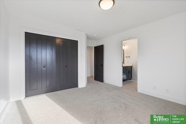 5721 N 197th Ave, Omaha, NE 68022 - unfurnished bedroom with carpet, a closet, and connected bathroom