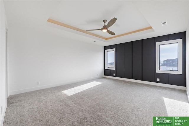 5721 N 197th Ave, Omaha, NE 68022 - carpeted spare room with a tray ceiling and ceiling fan