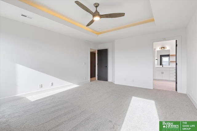 5721 N 197th Ave, Omaha, NE 68022 - empty room with carpet, a ceiling fan, and a raised ceiling