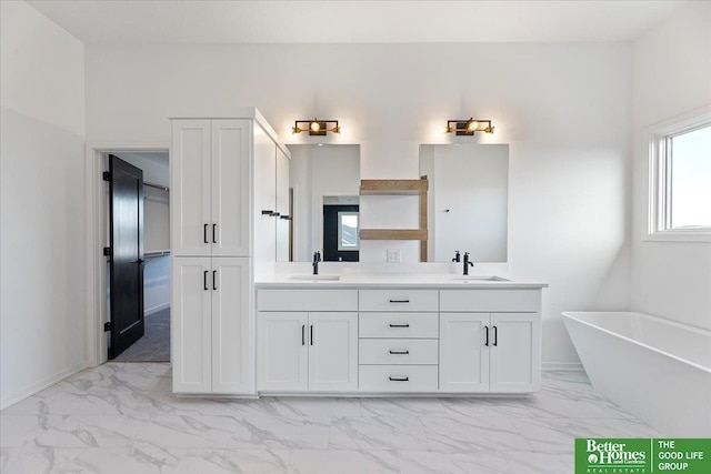 5721 N 197th Ave, Omaha, NE 68022 - bathroom featuring marble look tiles, double vanity, and a freestanding bath