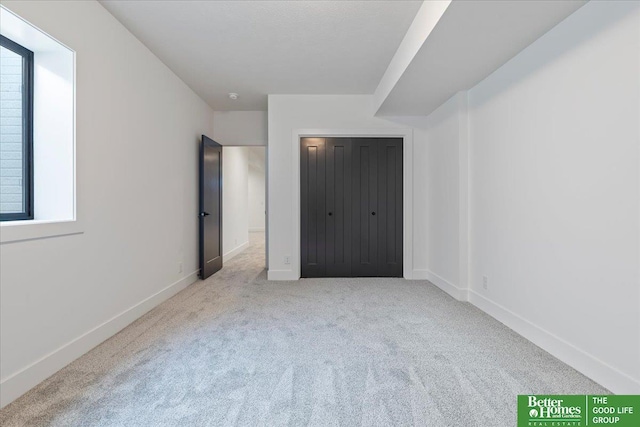 5721 N 197th Ave, Omaha, NE 68022 - unfurnished bedroom featuring carpet flooring and multiple windows