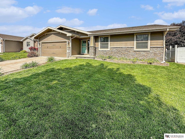 1809 SW Derek Ave, Lincoln, NE 68522 - view of front of house featuring stone siding, an attached garage, and driveway