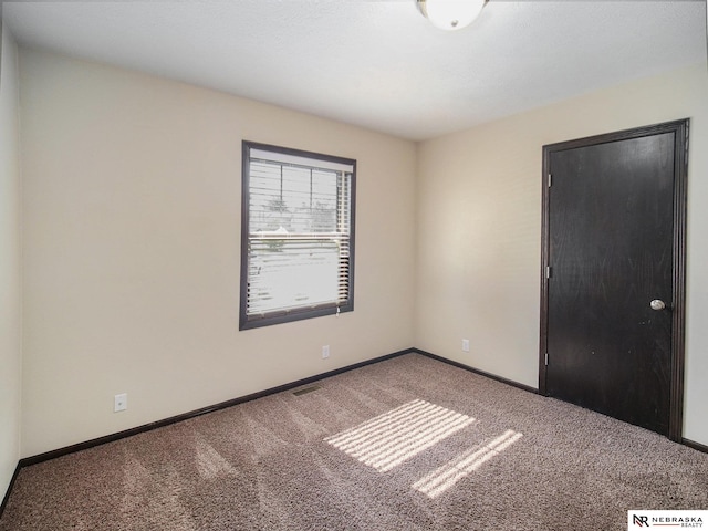 1809 SW Derek Ave, Lincoln, NE 68522 - unfurnished room with carpet and baseboards