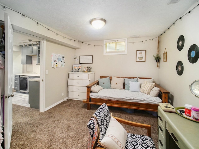 1809 SW Derek Ave, Lincoln, NE 68522 - carpeted bedroom with beverage cooler and a textured ceiling