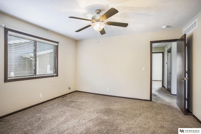1809 SW Derek Ave, Lincoln, NE 68522 - unfurnished room featuring carpet floors, ceiling fan, and a smoke detector