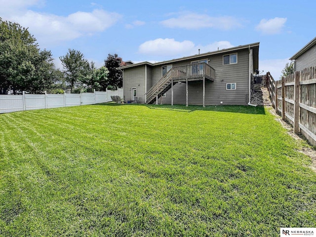 1809 SW Derek Ave, Lincoln, NE 68522 - back of property featuring stairs, a deck, and a fenced backyard