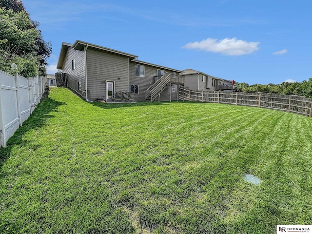 1809 SW Derek Ave, Lincoln, NE 68522 - fenced backyard featuring stairs and a deck