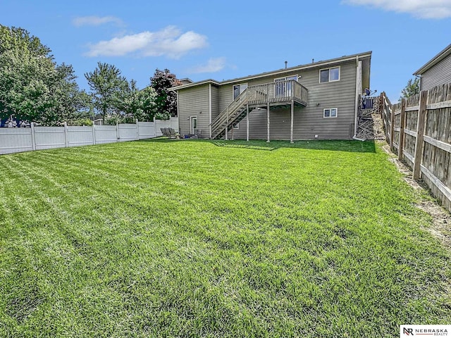 1809 SW Derek Ave, Lincoln, NE 68522 - back of property featuring stairway, a wooden deck, and a fenced backyard