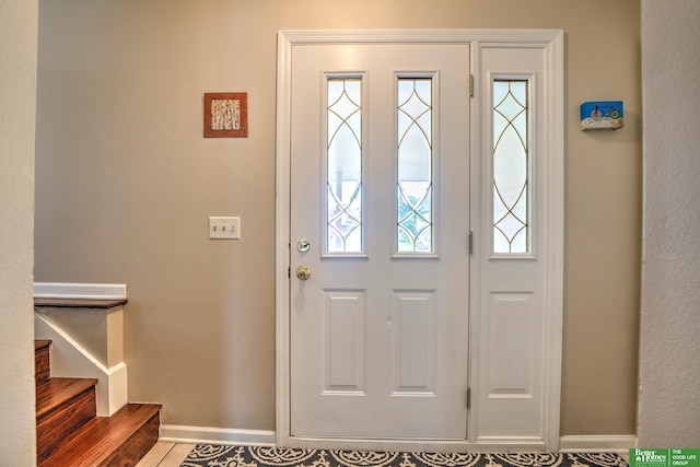 14824 Charles Plz, Omaha, NE 68154 - entryway featuring baseboards and stairway