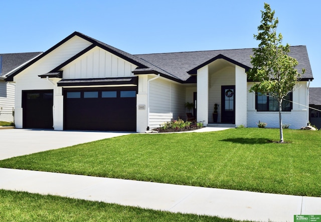 5445 Kestrel Pkwy, Omaha, NE 68022 - modern farmhouse with an attached garage, a front lawn, a shingled roof, concrete driveway, and brick siding