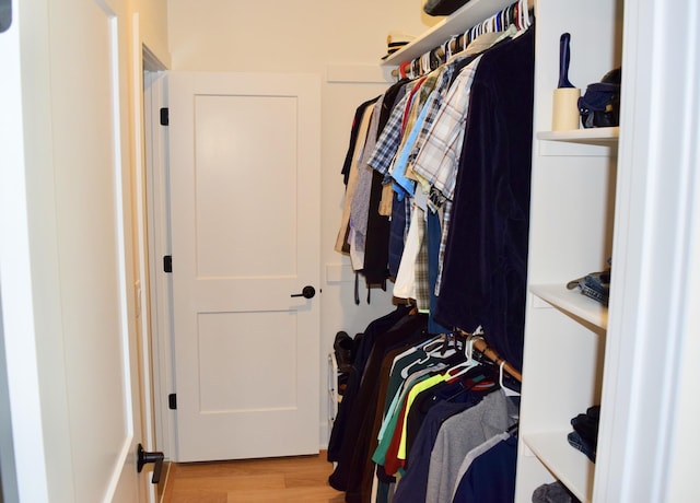 5445 Kestrel Pkwy, Omaha, NE 68022 - walk in closet featuring wood finished floors