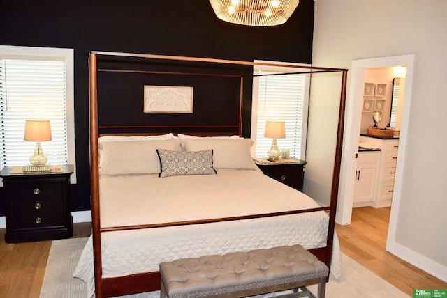 5445 Kestrel Pkwy, Omaha, NE 68022 - bedroom with light wood-type flooring and ensuite bathroom