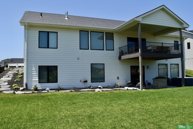 5445 Kestrel Pkwy, Omaha, NE 68022 - rear view of house with a balcony, a lawn, and a shingled roof