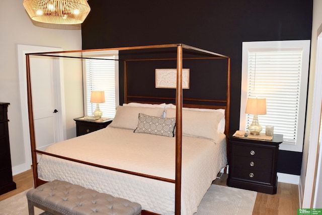 5445 Kestrel Pkwy, Omaha, NE 68022 - bedroom with wood finished floors and baseboards