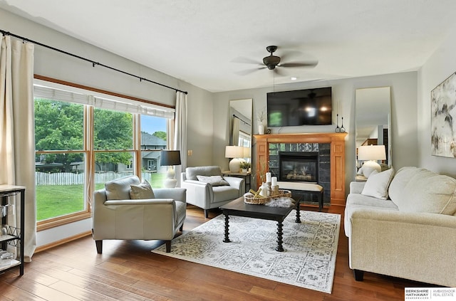 17534 Jefferson St, Omaha, NE 68135 - living room featuring a ceiling fan, wood finished floors, and a tiled fireplace