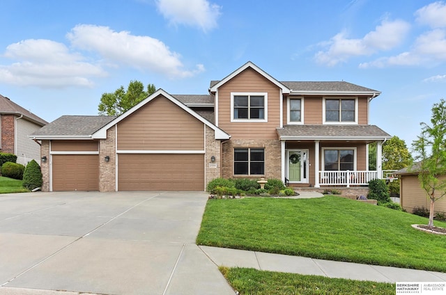 17534 Jefferson St, Omaha, NE 68135 - view of front of house featuring covered porch, concrete driveway, a front lawn, and a garage
