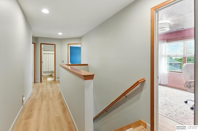 17534 Jefferson St, Omaha, NE 68135 - corridor with an upstairs landing, light wood-style flooring, and recessed lighting
