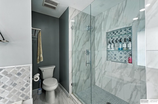 17534 Jefferson St, Omaha, NE 68135 - bathroom featuring toilet and a marble finish shower