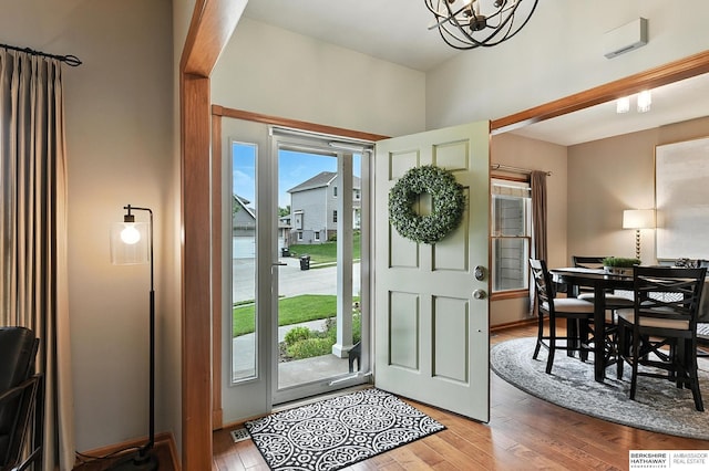 17534 Jefferson St, Omaha, NE 68135 - entrance foyer featuring wood finished floors and a chandelier