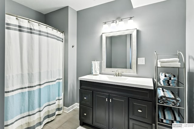 17534 Jefferson St, Omaha, NE 68135 - full bath with vanity, tile patterned floors, and a shower with shower curtain