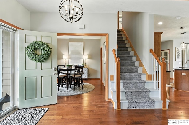 17534 Jefferson St, Omaha, NE 68135 - entryway featuring stairway, hardwood / wood-style floors, a chandelier, and recessed lighting