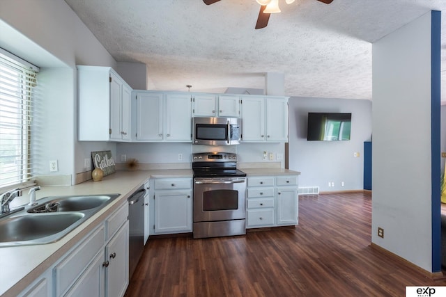 6633 N 115th St, Omaha, NE 68164 - kitchen featuring stainless steel appliances, ceiling fan, dark wood finished floors, light countertops, and a textured ceiling