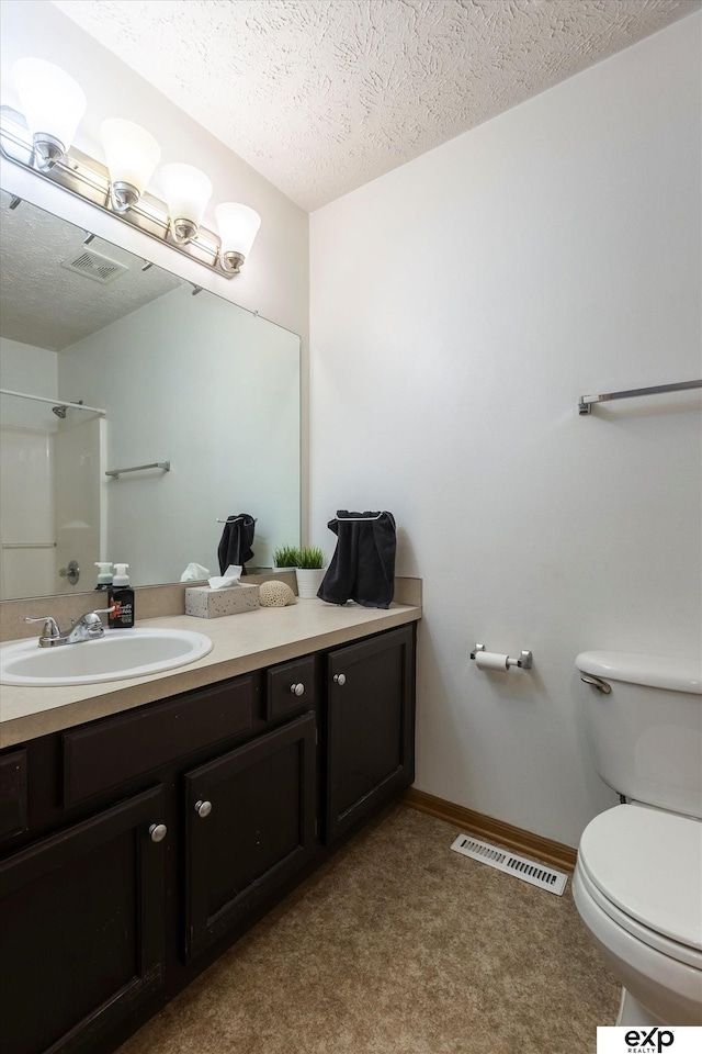 6633 N 115th St, Omaha, NE 68164 - bathroom featuring vanity, a shower, and a textured ceiling
