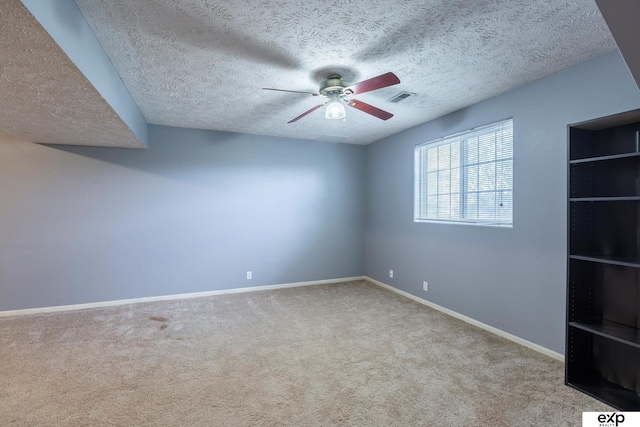 6633 N 115th St, Omaha, NE 68164 - carpeted spare room with a ceiling fan and a textured ceiling