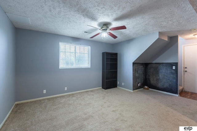 6633 N 115th St, Omaha, NE 68164 - additional living space featuring ceiling fan, carpet, and a textured ceiling