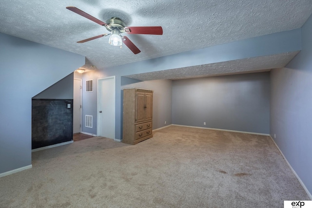 6633 N 115th St, Omaha, NE 68164 - additional living space featuring carpet flooring, a ceiling fan, and a textured ceiling