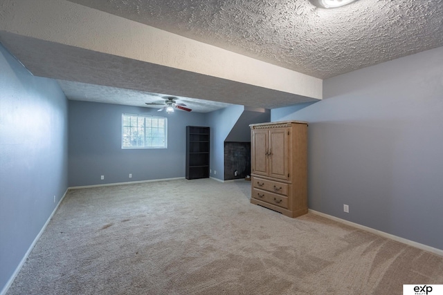 6633 N 115th St, Omaha, NE 68164 - bonus room featuring a textured ceiling, a ceiling fan, and light colored carpet