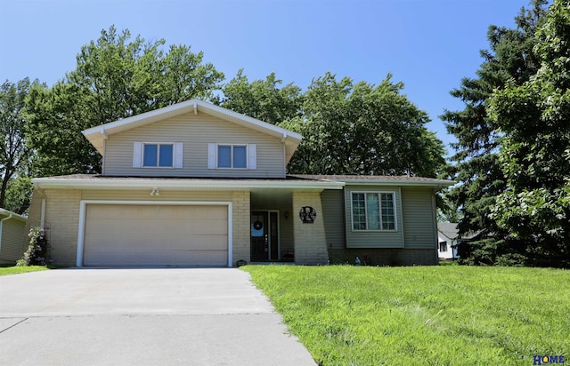 1365 N Chestnut St, Wahoo, NE 68066 - view of front of home with driveway, a front yard, and an attached garage