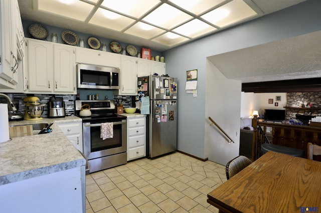1365 N Chestnut St, Wahoo, NE 68066 - kitchen featuring appliances with stainless steel finishes, light countertops, and white cabinets