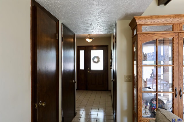 1365 N Chestnut St, Wahoo, NE 68066 - entrance foyer featuring a textured ceiling and light tile patterned floors