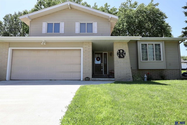 1365 N Chestnut St, Wahoo, NE 68066 - view of front facade with a front yard, driveway, brick siding, and an attached garage