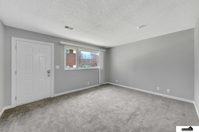 1207 B St, Lincoln, NE 68502 - empty room with carpet and a textured ceiling