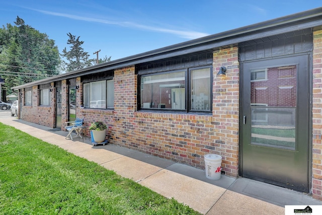 1207 B St, Lincoln, NE 68502 - view of front of home featuring brick siding and a front yard