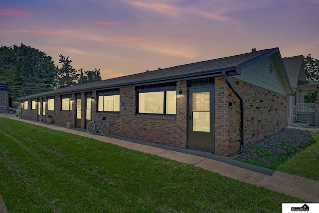 1207 B St, Lincoln, NE 68502 - ranch-style house with brick siding and a front lawn