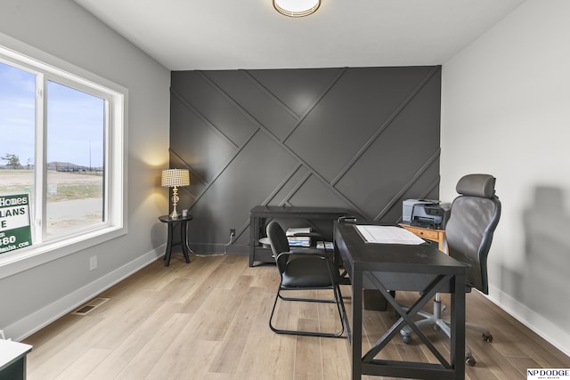 20976 Ogden St, Elkhorn, NE 68022 - office with light wood-style flooring and a decorative wall