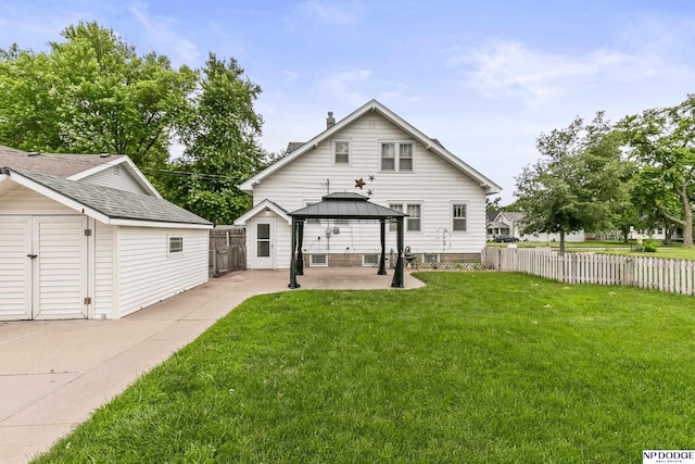 1107 E 1st St, Fremont, NE 68025 - back of house featuring a patio area, a gazebo, an outbuilding, and a chimney