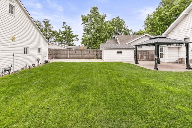 1107 E 1st St, Fremont, NE 68025 - fenced backyard with a gazebo and a patio area